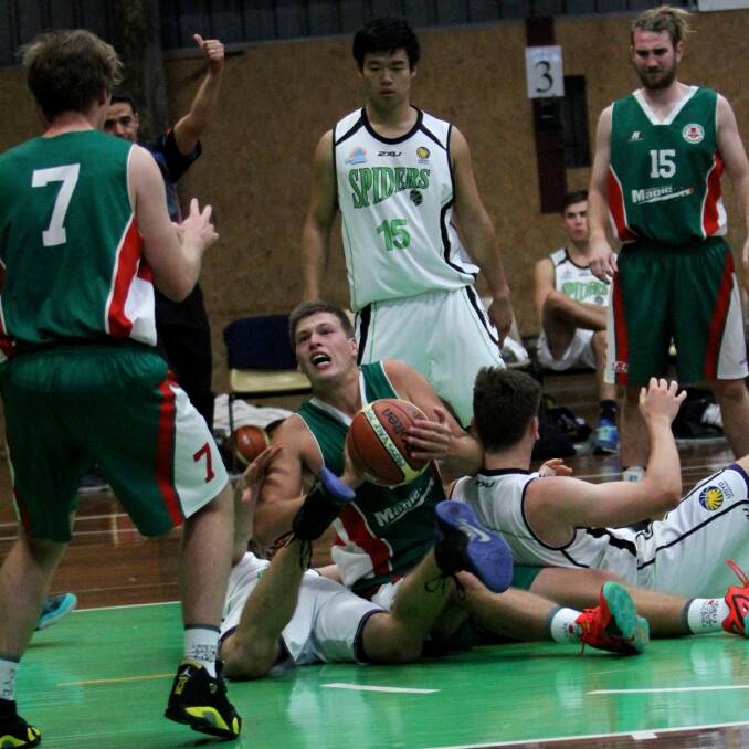 Right: Hayden Cook (with ball) was a standout performer for Moss Vale Magic on Saturday night.  
           Photo by  
      Daniel Bennett
