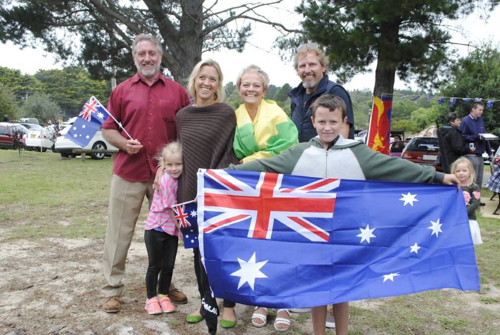 Mittagong resident George Hyland, Phoebe (5) and Sally Brauer from Sydney, Mittagong residents Allison Hyland, Scott Armstrong and 11-year-old Jackson Armstrong Hyland at the Wingecarribee Shire's Australia Day ceremony at Berrima. 	Photo by Emma Biscoe