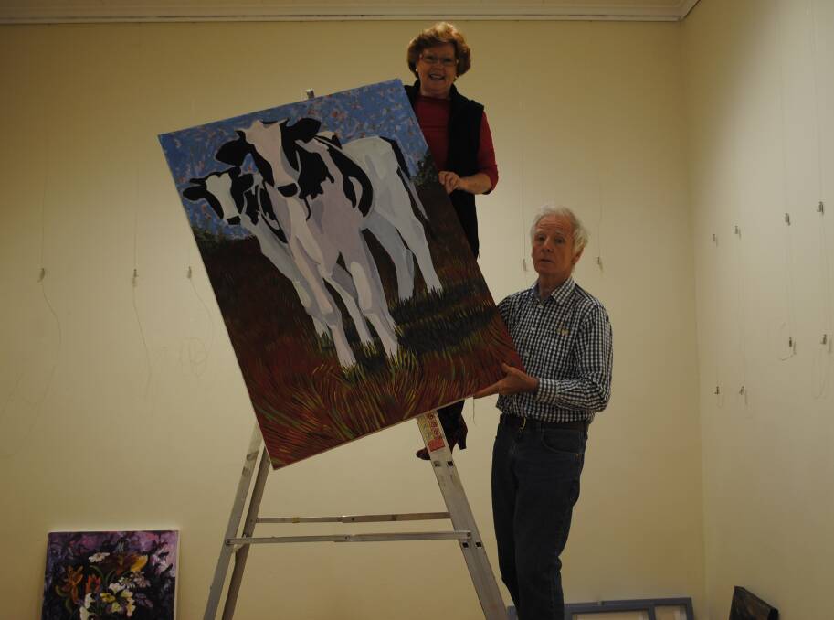 Maureen Varnavsky and Tony Deigan with some of the tutor's artworks. Photo by Dominica Sanda