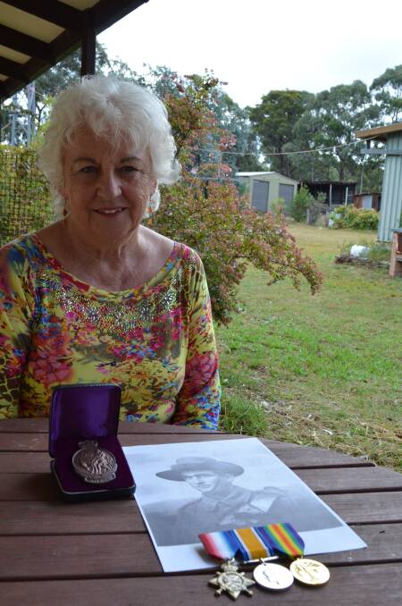 Canyonleigh farmer Jacqueline Wilson with a picture of her father and his medals. She missed the Gallipoli centenary ceremony after being struck and injured by a car outside her Istanbul hotel.	 Photo: Emma Biscoe.
