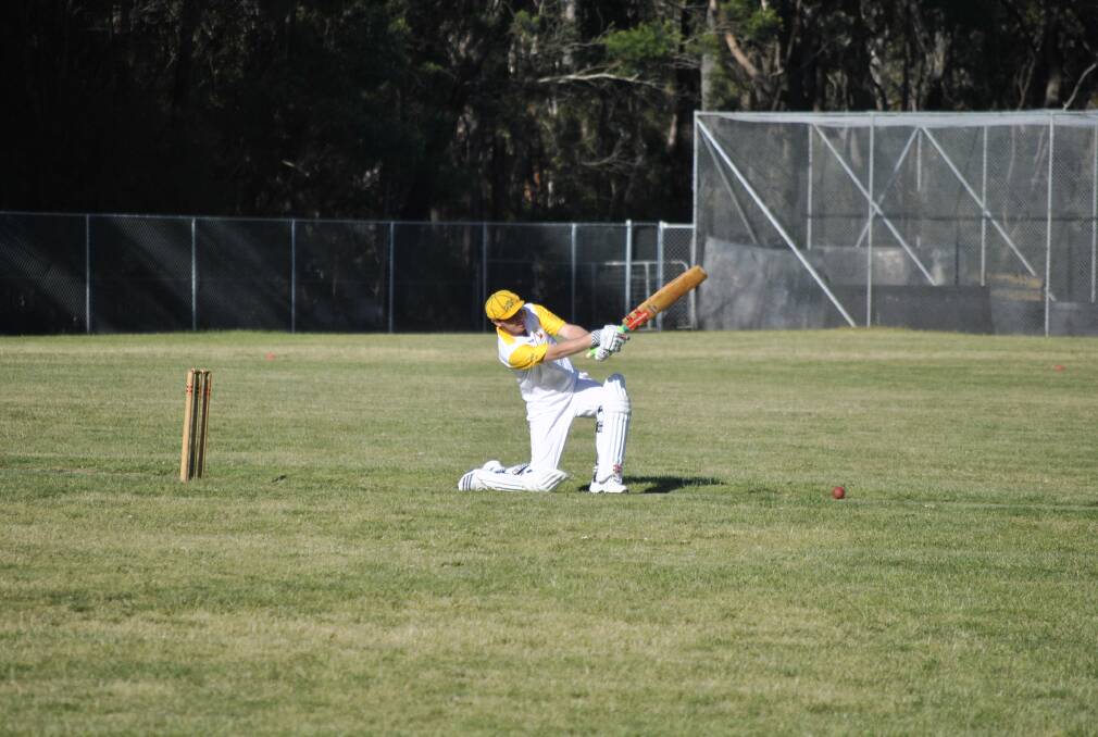 Chris Packer smashes a ball down the ground during Hill Top's second grade loss on Saturday. Photo by Josh Bartlett