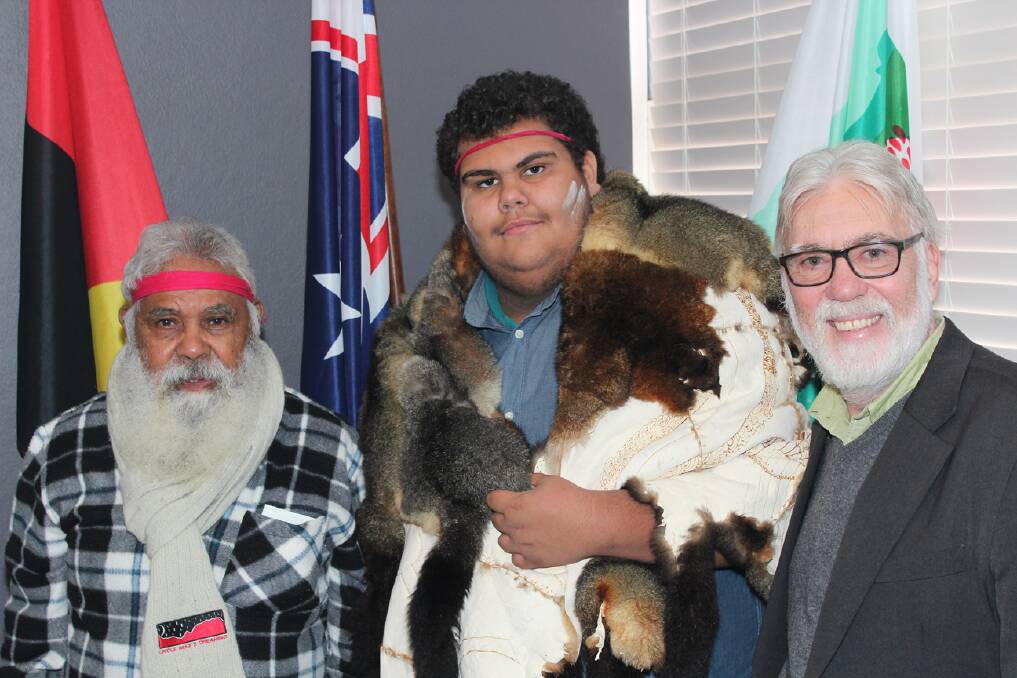 Uncle Max, Patrick Logan (wearing the Possum Skin Cloak) and mayor Larry Whipper. Photo supplied