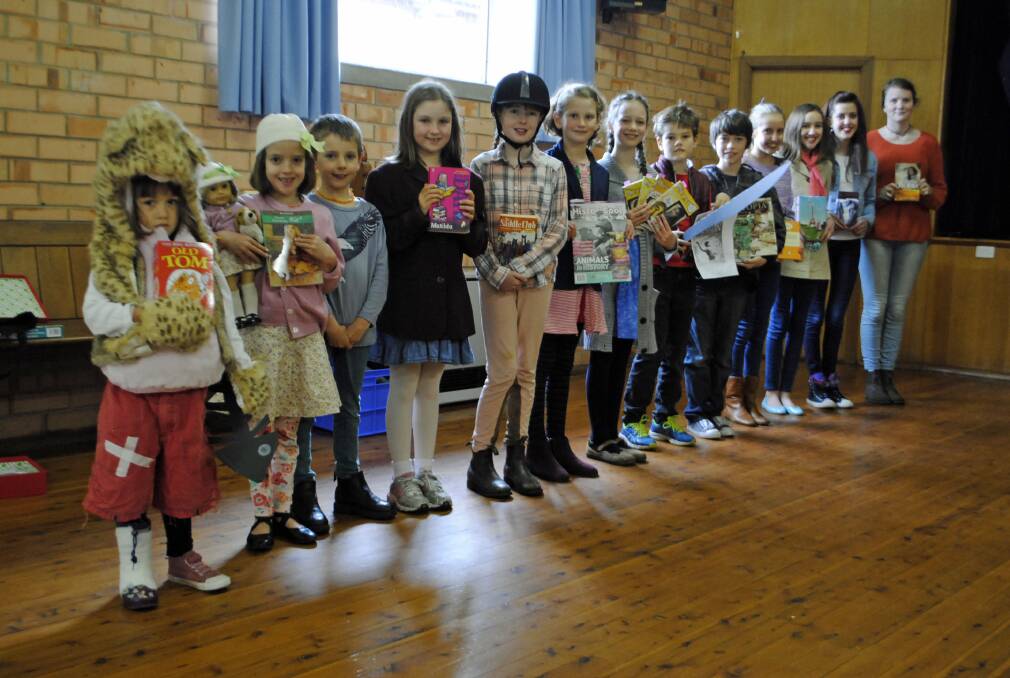 Southern Highlands Home Education Group students participated in Book Week, most as favourite character: (L-R) Rosie Fox, 4 (Old Tom), Olive Love, 6 (Kit Kittredge: An American Girl), Zadan Evans, 7, Siobhan McElhone, 8 (Matilda), Tia Evans, 10 (Saddle Club), Pi Jeffares, 9 (historical magazine), Freya Hernell, 8 (Grace - Our Australian Girl), Alexi Fox, 9 (Percy Jackson, Lightning Thief), Emerson Williams, 12 (Dinotopia), Cedar Love, 11 (Gerald Durrell), Mimi Love, 13 (My Secret Guide to Paris), Iris Love, 14 (The Outsiders), and Rose Attreed, 15 (Jumping Fences). 	Photo Ainsleigh Sheridan