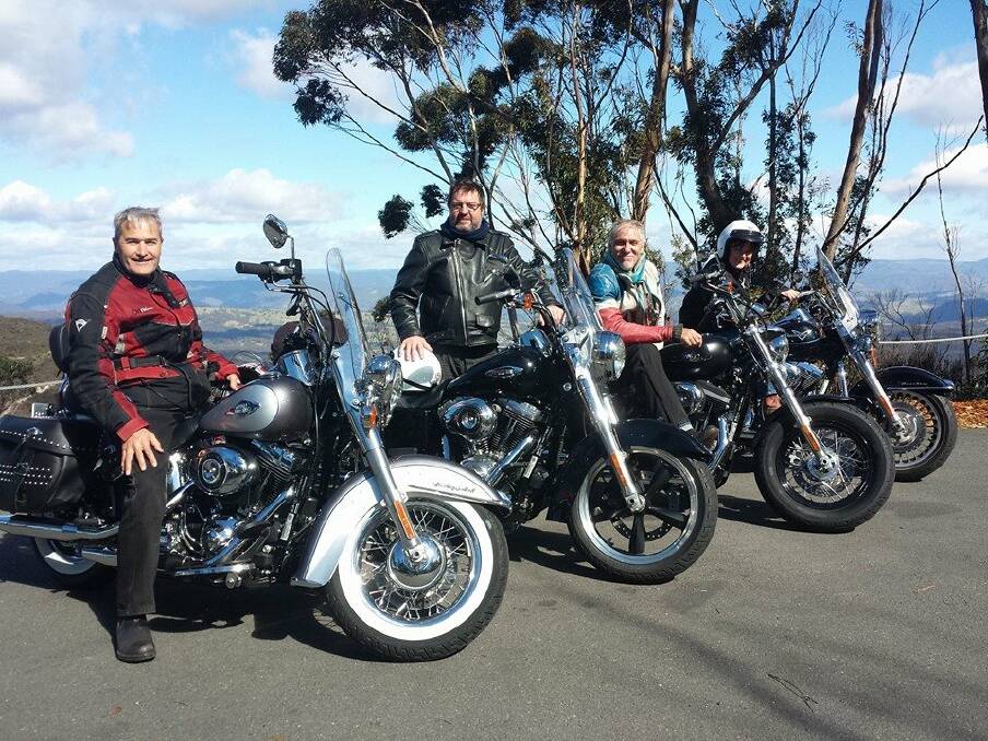 Left: 'MILD HOGS' travel writers Simon Mallender, Roderick Eime, Keith Austin and Deborah Dickson-Smith at Cliff Drive, Katoomba during their three-day ride. 	Photo by Will Keith