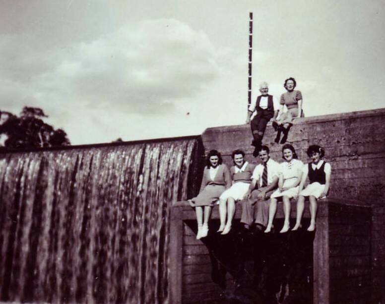  Some locals pose at the Cement Works water supply weir in 1941.