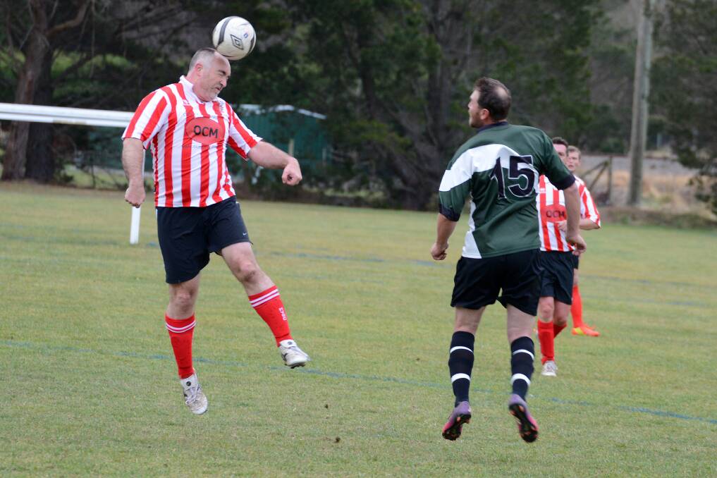 Moss Vale R's Ian Campbell goes up for a header against Yerrinbool B at Church Road Soccer Fields on Saturday. Photo by Roy Truscott