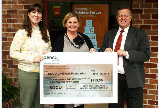 BDCU Children's Foundation vice-president Ross Stone receives a $415 cheque from chairwoman of the Southern Highlands Business Women's Network Kathy Barnsley and Melissa Meredith from Highlands Pit Lane. Photo supplied