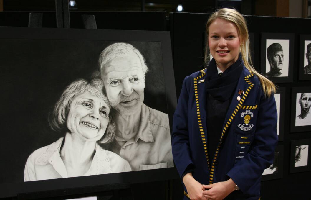 Zoe Binder with her charcoal portait. Photo supplied