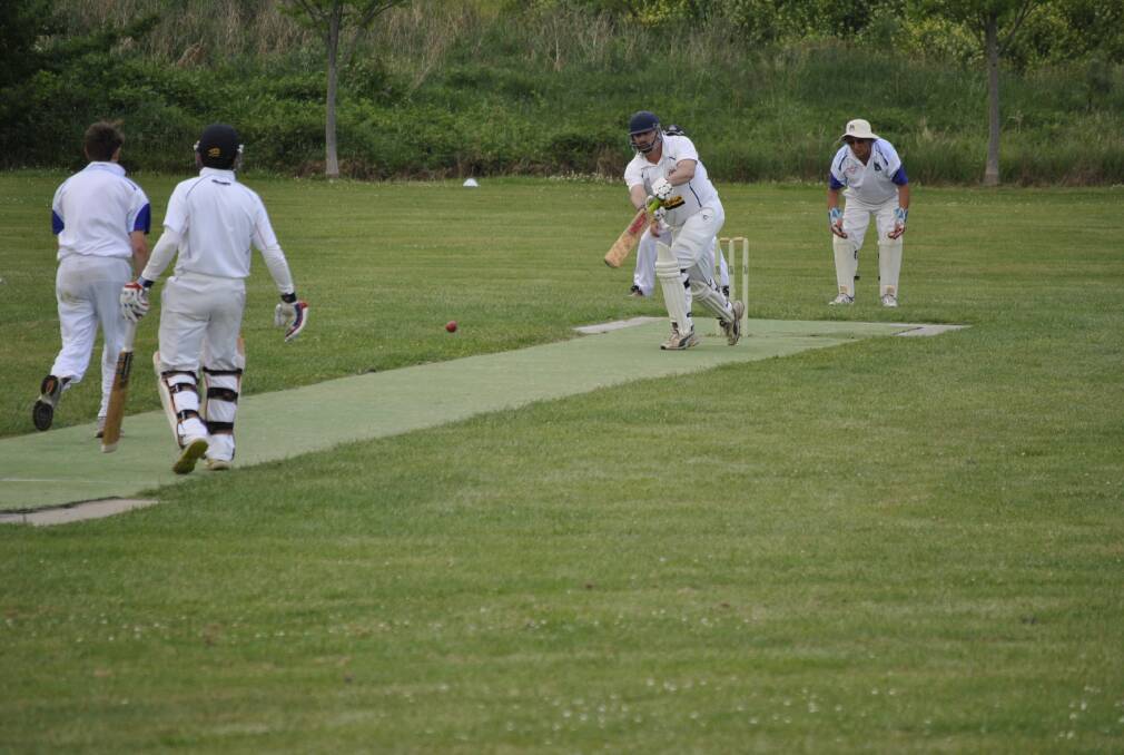 Bowral thirds batsman Greg Kruger pushes a ball down the ground. 
						   Photo by Josh Bartlett