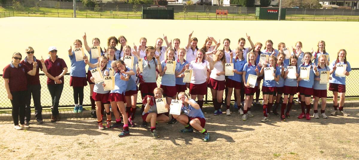 The three successful Chevalier College hockey teams combine to celebrate recently. 							 Photos supplied