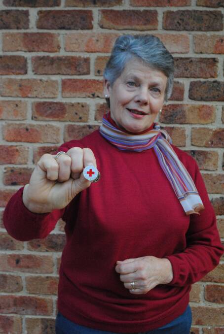 Veronica Susan Webb with the Red Cross badge she was given after making 100 blood donations. Photo by Victoria Lee