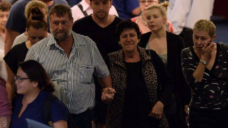 The parents of Phillip Hughes, Greg and Virginia, leave St Vincent's Hospital on Thursday.  Photo: Saeed Khan/AFP