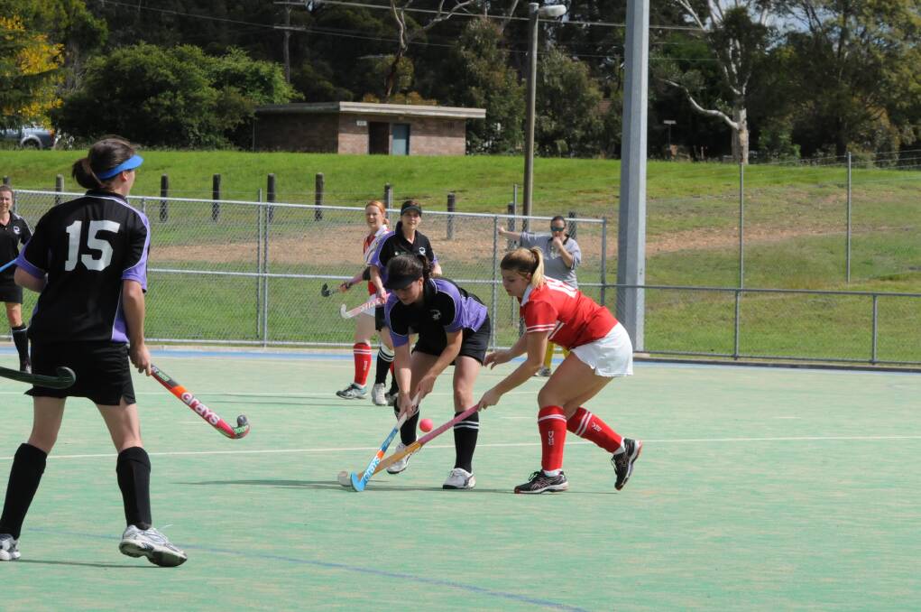 Sports and Moss Vale players both go after the ball. Photo by Lauren Strode