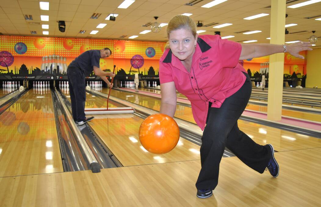 Highlands Tenpin assistant manager Diane McAusland shows her best bowling technique while technician/maintenance supervisor James Bailey prepares a lane for Sunday s state final. Photos by Josh Bartlett