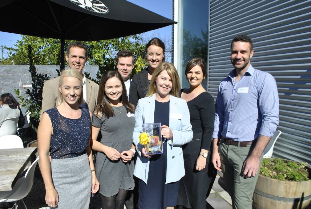The Duncan Hill team (back): Duncan Hill, Peter Oakley, Hannah Forbes, Stacey Lee and Matthew Sparke. (front): Amee Kilpatrick, Jamie-Lee Chetcuti and Linda Tyler holding the donation jar at their Biggest Morning Tea fundraiser earlier this year. 	Photo by Claire Fenwicke