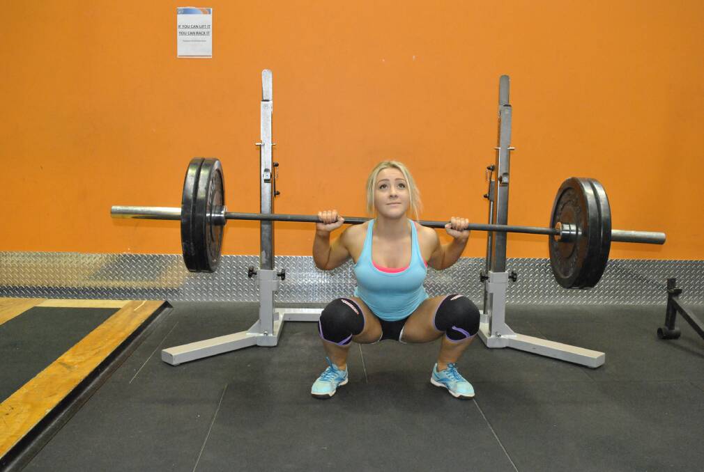 Mittagong powerlifter Eve Vece is training hard ahead of the Oceania and Asia Raw Powerlifting Championships. 							    Photo by Josh Bartlett