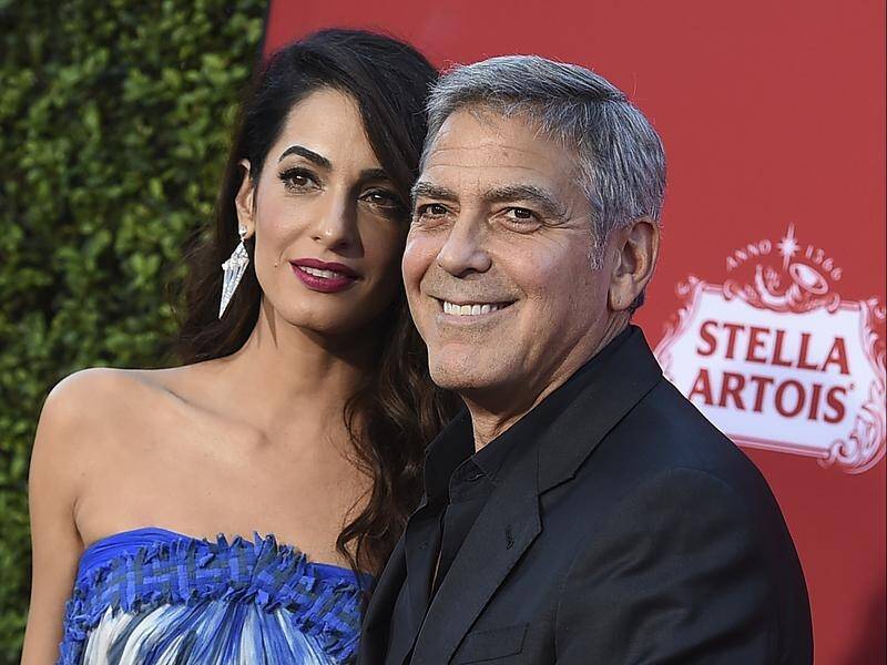 George and Amal Clooney are donating to students organising marches against gun violence.