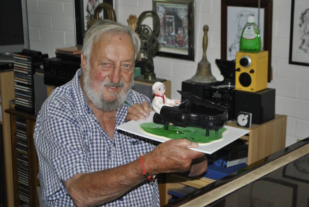Geoff Harvey was excited to be presented with a cake from local baker Barbara Van Eck. 
	 Photo by Emily Bennett