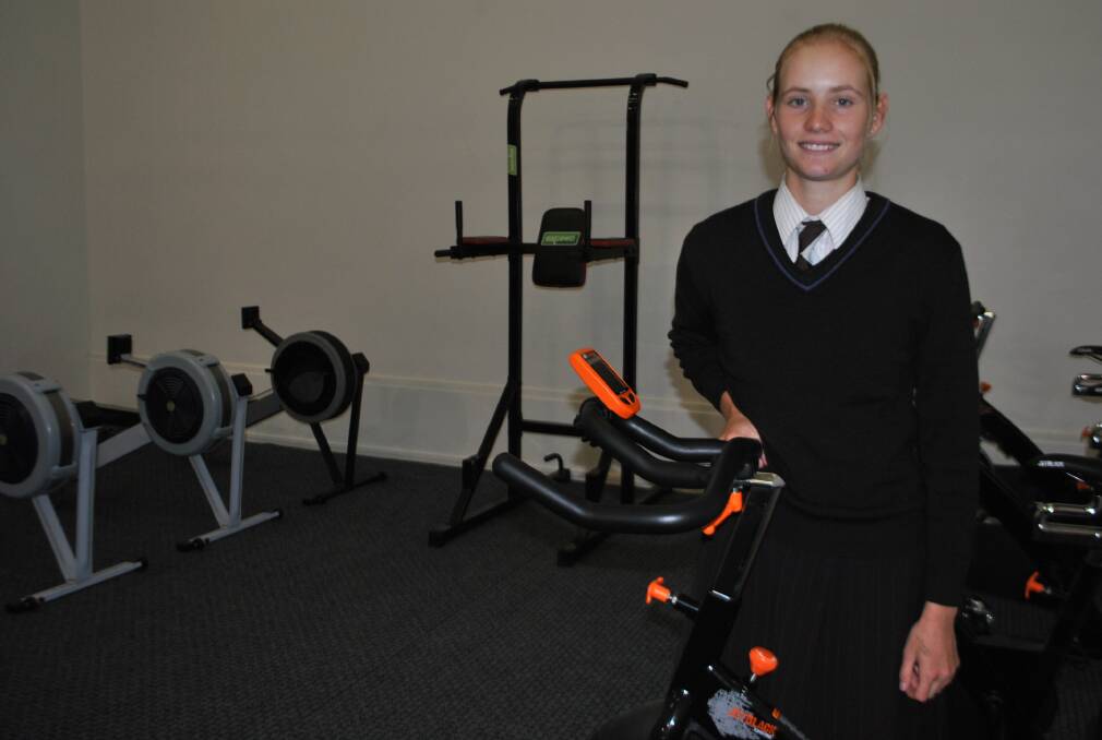 Frensham School student Paige Wilson is working hard at the gym to build up her fitness base ahead of the 2015 Youth Commonwealth Games. 				         Photo by Josh Bartlett