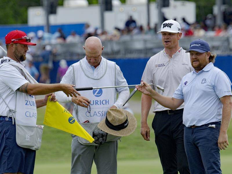 Zac Blair (right) and Patrick Fishburn (second right) lead after day three of the Zurich Classic. (AP PHOTO)