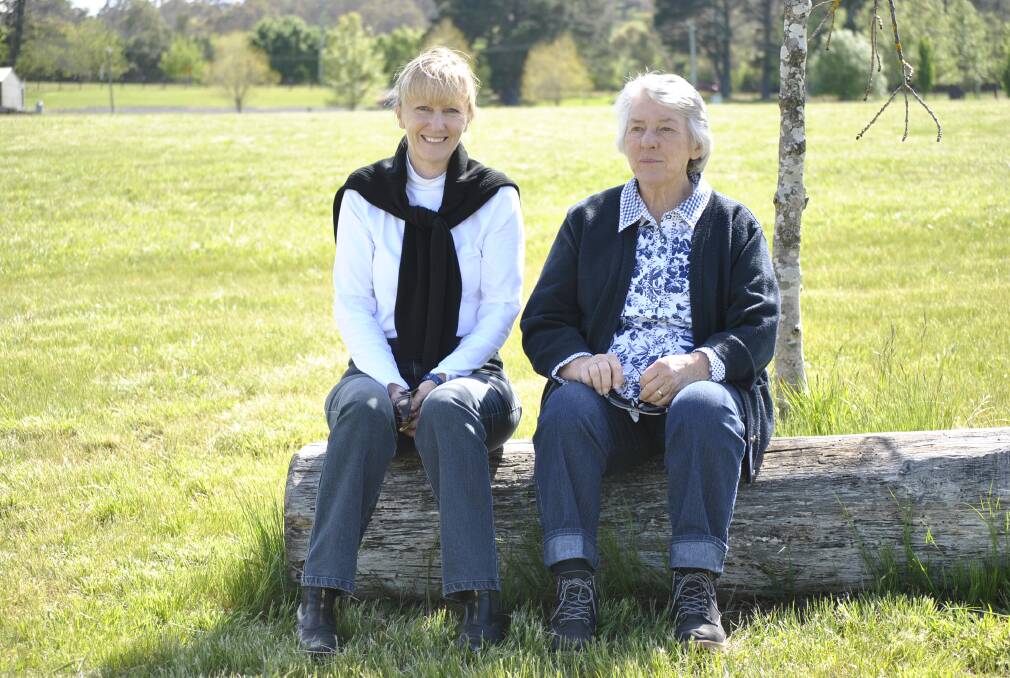 Bowral Dressage Club member Jo Poole and Bowral's Carolyn Lieutenant watch the action at Bong Bong Racecourse.