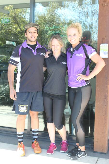 Anytime Fitness personal trainer Chris Hilder with Kylie Whatman and Jamie Bow who have organised the Special Olympics fundraiser. 	Photo by Megan Drapalski