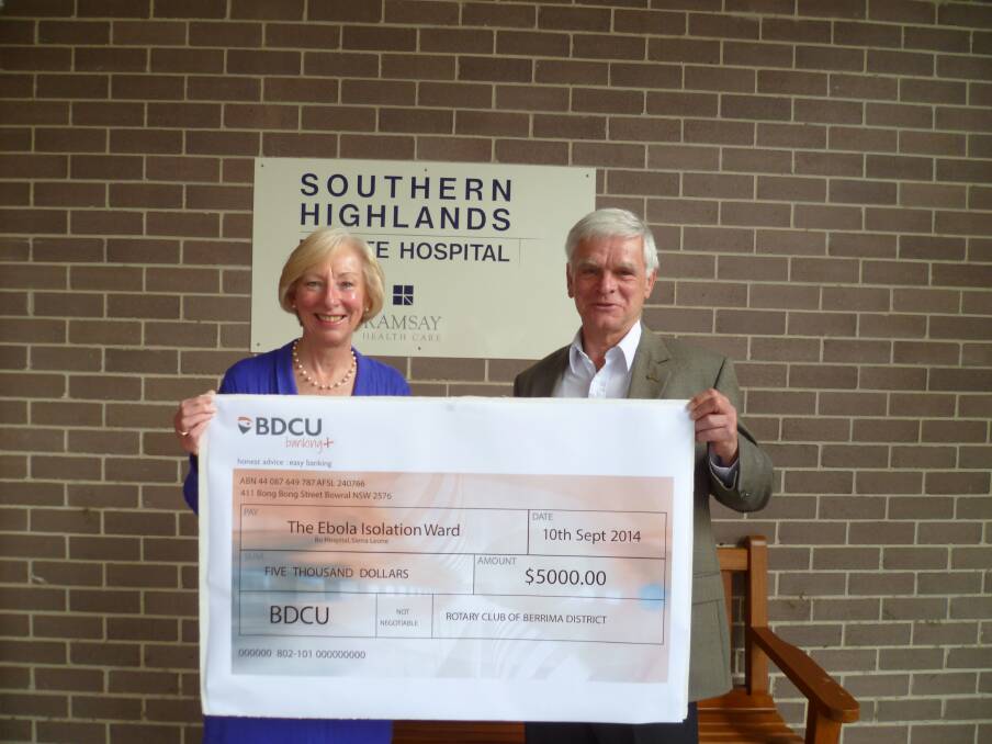 Richard Krohn of Rotary Club of Berrima District in partnership with Southern Highlands Private Hospital CEO Jenny Harper on behalf of Ramsay Health present a cheque for $5000 to assist with building an isolation ward in the Bo Hospital in Sierra Leone. 
Photo supplied.