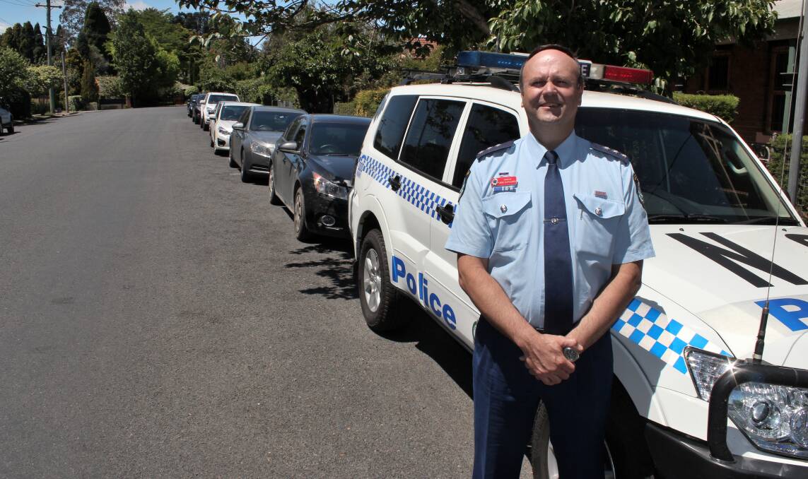 Inspector Klepczarek with his police car at Bowral Police Station. Photo by Megan Drapalski