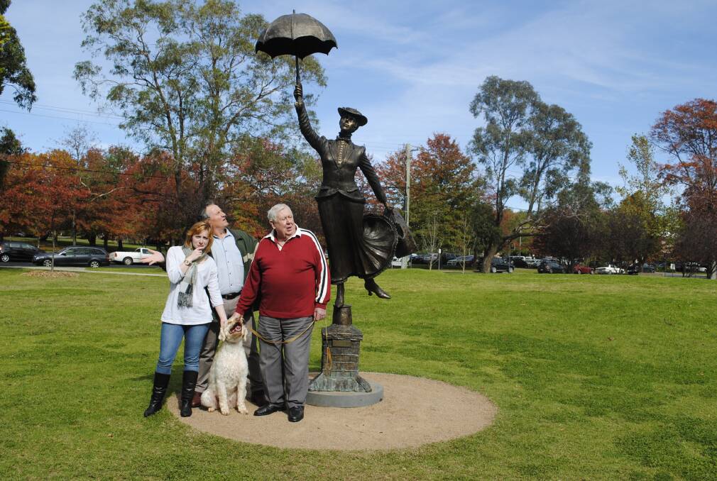 Melissa McShane, George, Terry Oakes-Ash and Paul McShane inspect the Mary Poppins statue. Photo by Dominica Sanda