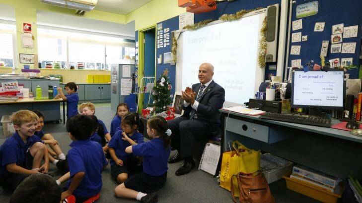 Former NSW education minister Adrian Piccoli during  a 2014 visit to Ultimo Public School. The school  is set to be hit hardest by the influx of residents into the Bays precinct.  Photo: Peter Rae