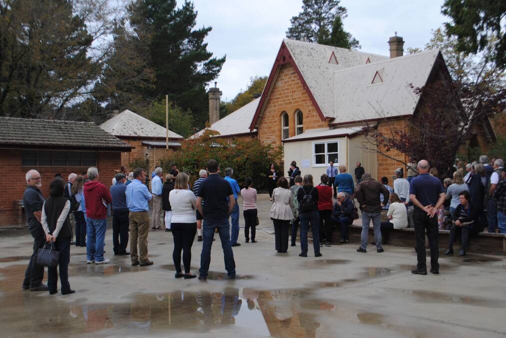 A crowd of bidders and spectators came out for the auction of the school. Photo by Emily Bennett