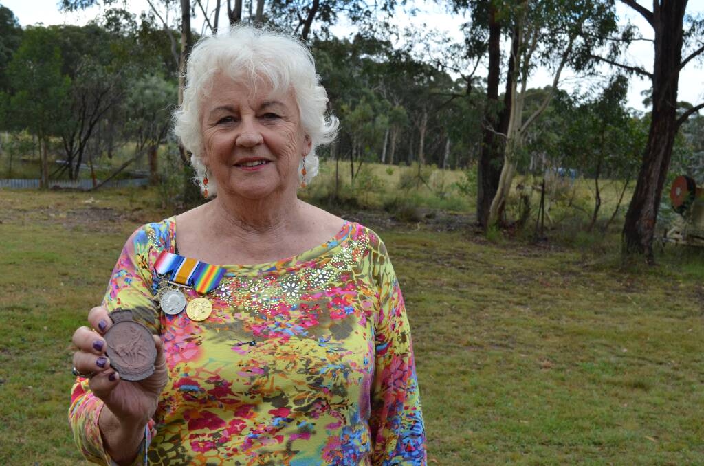 Jacqueline Wilson with her father's medals and Anzac medallion. Photo by Emma Biscoe