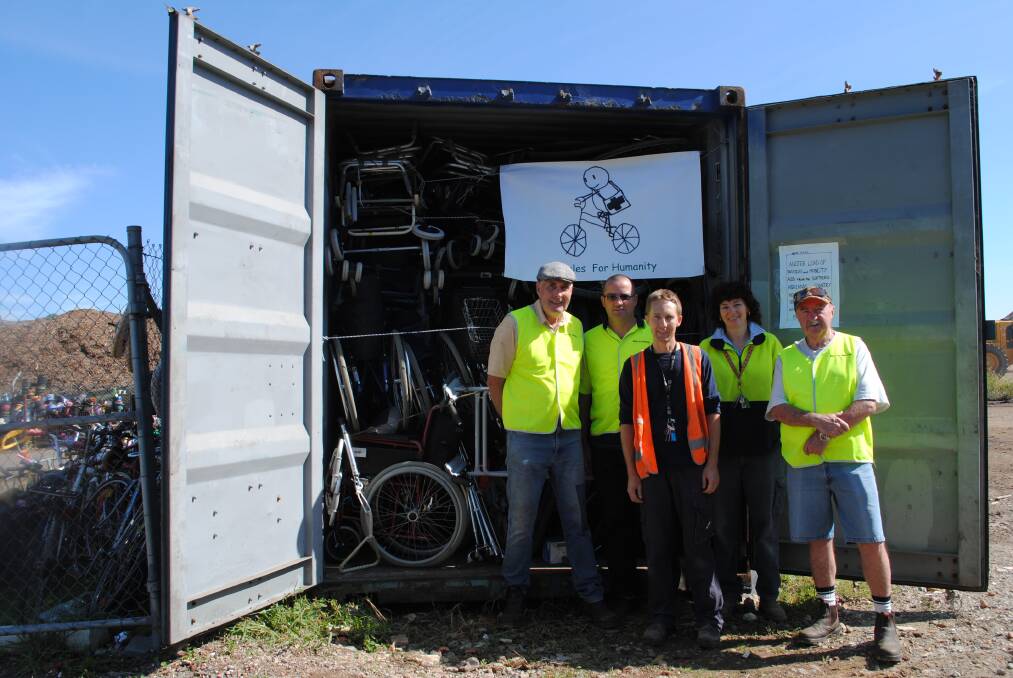 Hans Radowitz, Paul Teeuwen-Green, David Sheather, Ally Borland from the Resource Recovery Centre and Eddie Noble with the latest container of bikes bound for Namibia.  
	Photo by Megan Drapalski