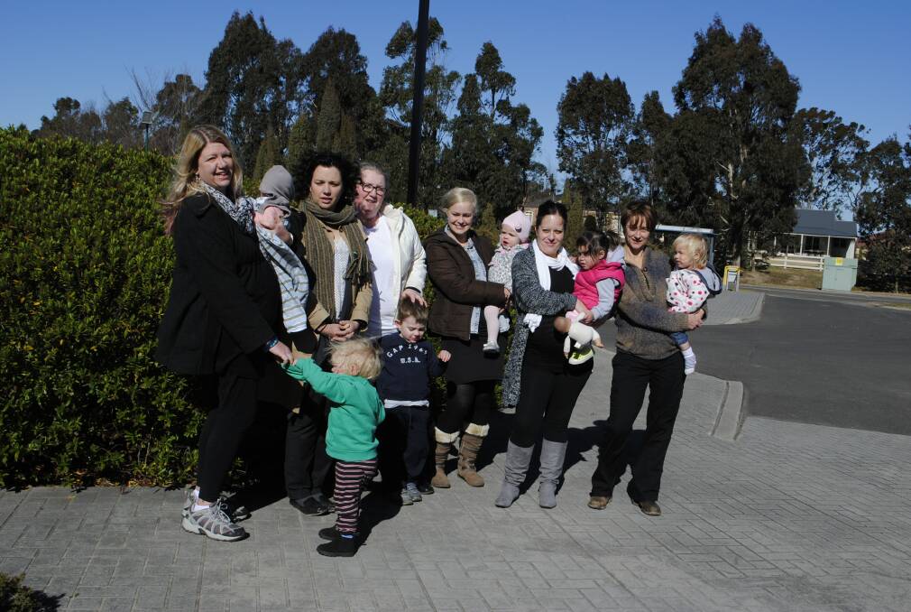Melissa McCandless, Jenny Wood, Kerian Robson, Kristie Swann, Alex Sewell and Erica Rundle with their children. The mothers have said they are being "targeted" with parking regulations at East Bowral Community Centre.	 Photo by Dominica Sanda