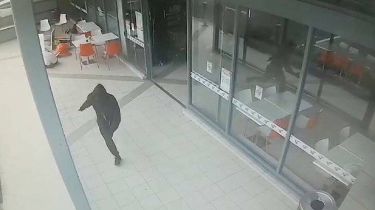 CCTV shows the moment an unidentified killer fatally shot Walid "Wally" Ahmad at a Bankstown shopping centre. Photo: Supplied