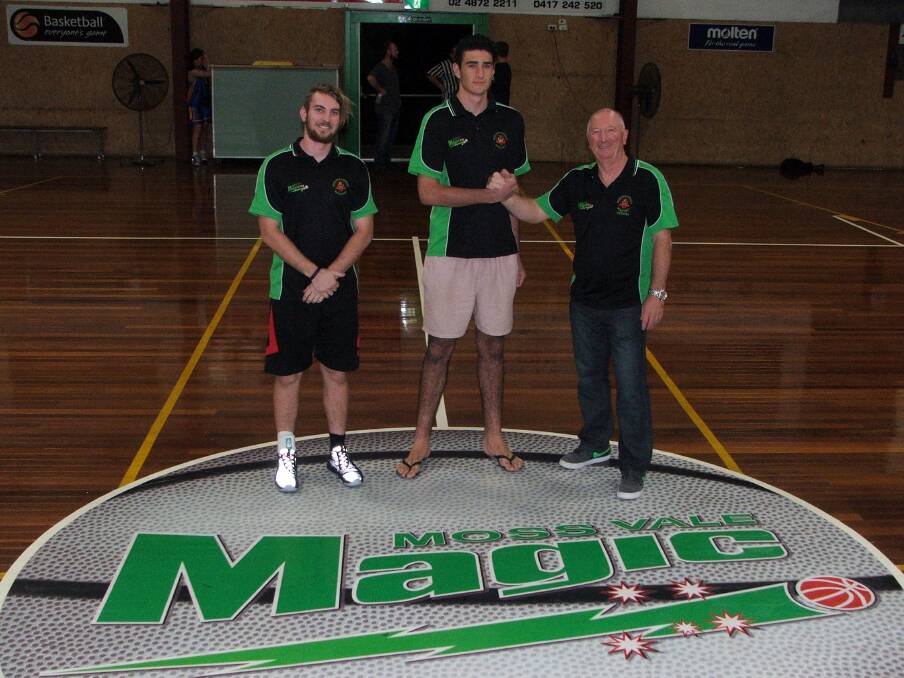 Moss Vale Magic captain Nick Bizjak (left) and coach Kevin Campbell (right) welcomes the club's off-season recruit Tyler Payne to Moss Vale Basketball Stadium. 						         Photo supplied