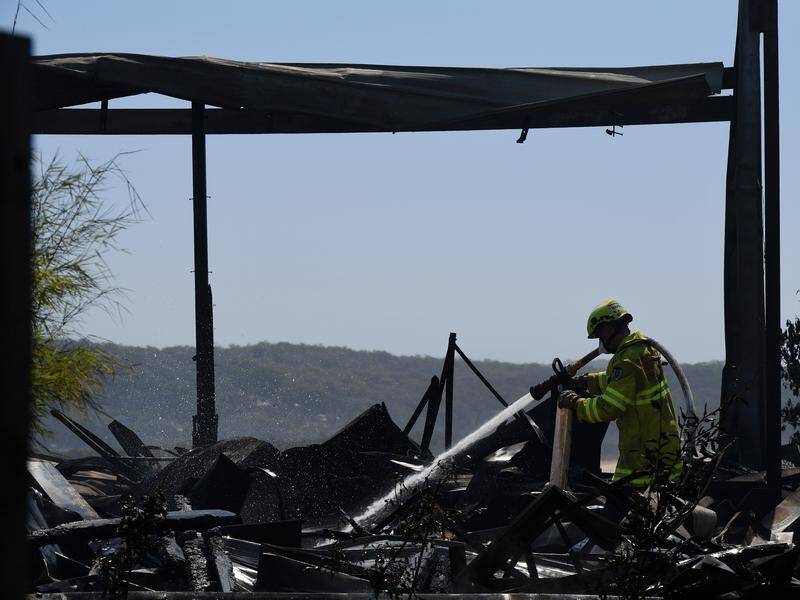 At least 70 homes and businesses have been damaged or destroyed by a bushfire at Tathra.