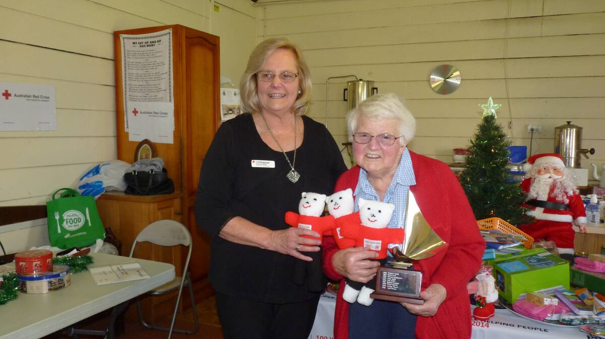 Zone 10 representative Shirley Wyatt presents Nellie Lawrance with the Yvonne Kennedy Memorial Trophy. 	Photo supplied