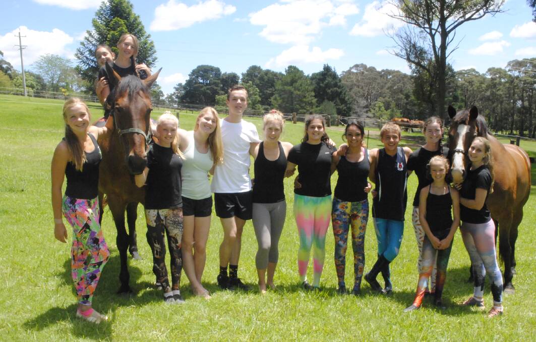 Vaulting athletes from all across pose for a photo at a junior team intensive camp in Alpine. Photo by Josh Bartlett
