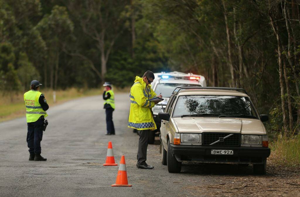 NSW Police stop and question motorists at a checkpoint on the outskirts of Kendall. Photo: Kate Geraghty