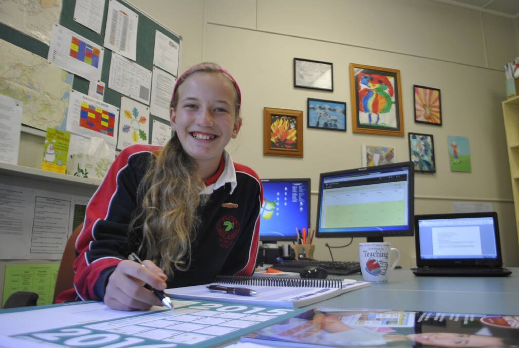 Exeter Public School leader Hayley Brown sits in the principal's chair for the day. 	Photo by Dominica Sanda