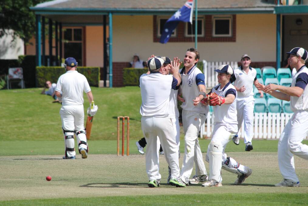 Paceman Mitch Wright (centre) and Robertson/Burrawang team mates celebrate a wicket during last season's HDCA first grade grand final. Photo by Josh Bartlett