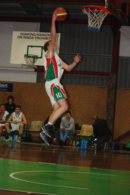 Dane Jansen prepares to dunk for the Moss Vale Magic on Saturday night. 						      Photos supplied by Jim Bizjak