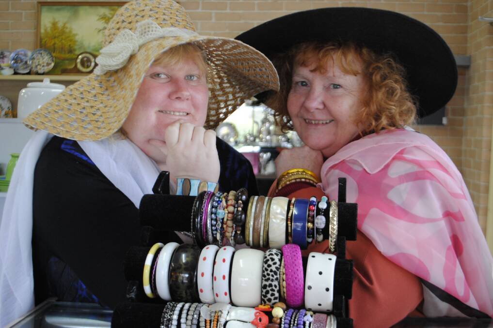 Southlansd Care op shop volunteer Riana Cashmere and manager Heather Wells model some of their wares. Photo Ainsleigh Sheridan