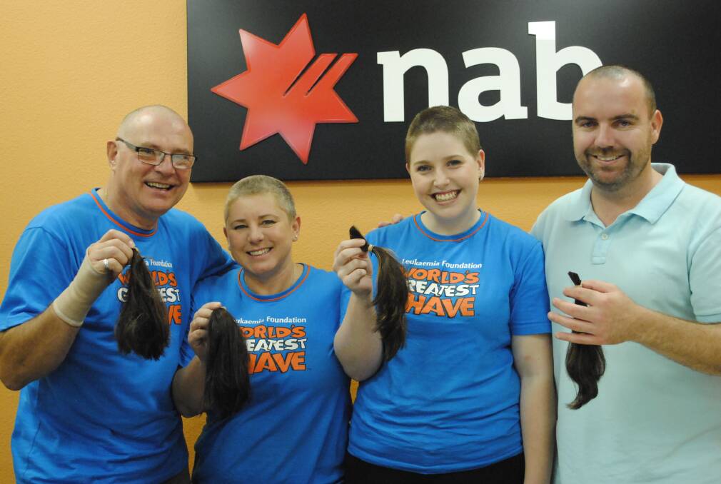 The NAB crew, Mikhael, Trudi, Bonnie and Paul with their shaved heads. 
	 Photo by Megan Drapalski