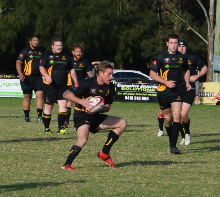 Cam Madden (with ball) was a standout in a losing cause for Bowral on Saturday. 							  Photo by Mindy Hindmarsh
