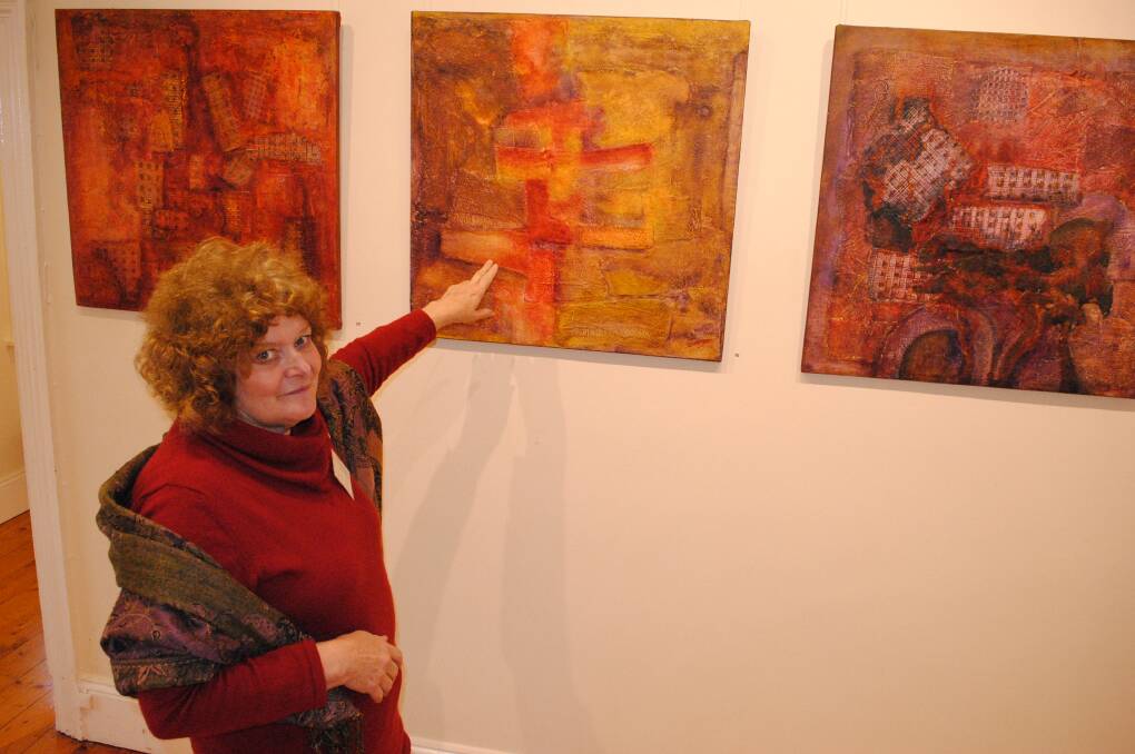 Artist Susan Southwood points out some of her pieces that feature in the Textures of the Past exhibition at Bowral and District Art Society (BDAS) Gallery. Photo by Josh Bartlett
