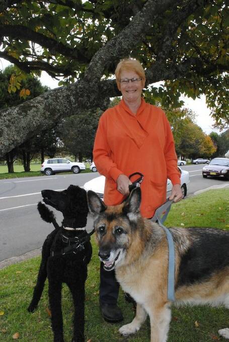 Lyndy Scott with her dogs Boo and Jazz, 16, at the Robertson Anzac Service.