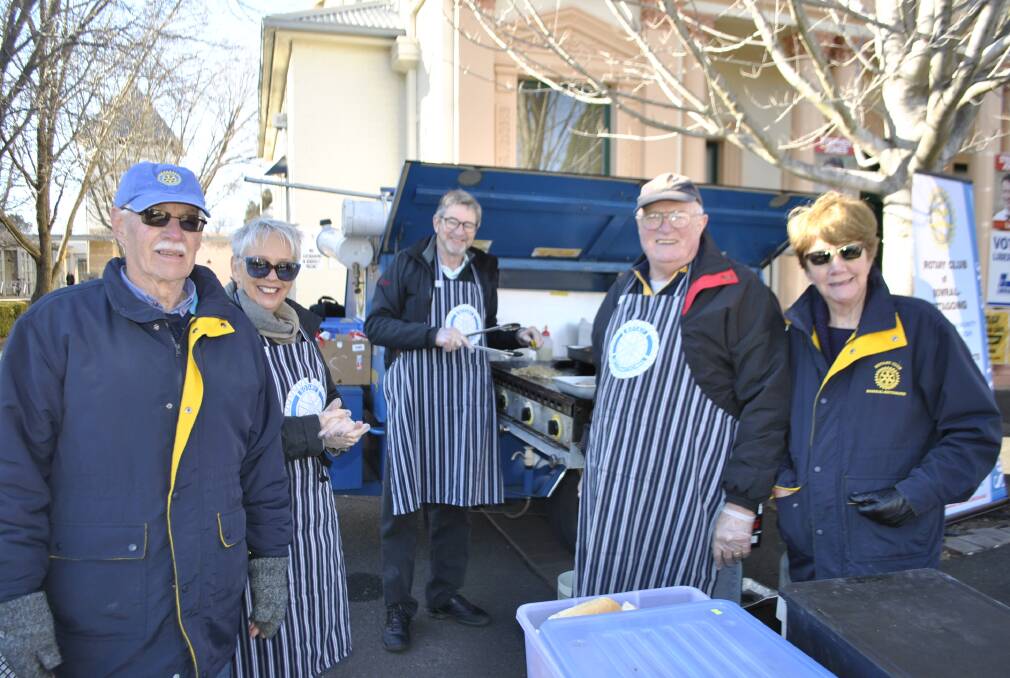 Rotary members Ian Cropper, Catherine Hussey, Don Graham, Ray Coulton and Sandra Adams manned the BBQ in Bowral. Photo by Claire Fenwicke