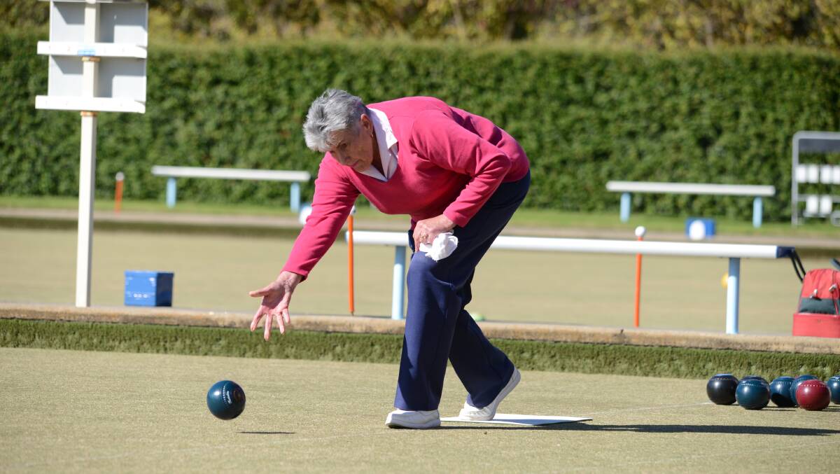 Nancy Pope plays a shot to keep her team in the lead.
